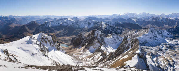 snow covered mountains in autumn. Blue sky. French Alps