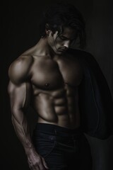 Fototapeta premium A muscular man demonstrates strength and poise with an artistic touch.