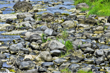 Beautiful, aesthetic and artistic river rocks with clear water in rural Asia Indonesia	