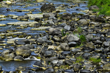 Beautiful, aesthetic and artistic river rocks with clear water in rural Asia Indonesia	