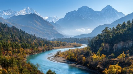 Scenic View of Serene River Flowing Through Autumn Forests with Majestic Mountains in Background Under Clear Blue Sky