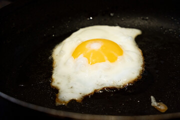 Cooking scrambled eggs.Fried egg in a frying pan.