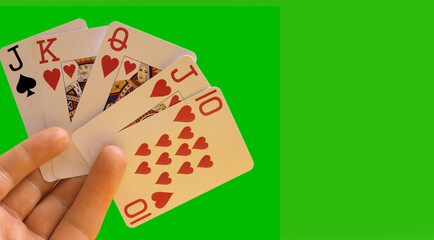 A busted royal flush in poker with copy space.A poker hand with four cards of the same suit that fails to form a flush when the final card is dealt