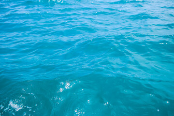 An abstract background of seawater flow under light exposure