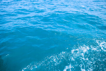 An abstract background of seawater flow under light exposure