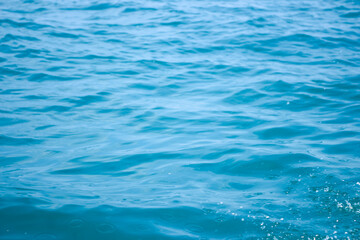 An abstract background of seawater flow under light exposure