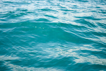 An abstract background of seawater flow under light exposure