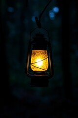 Illuminated lantern hangs, dark forest background.