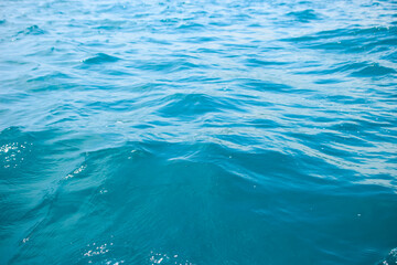 An abstract background of seawater flow under light exposure