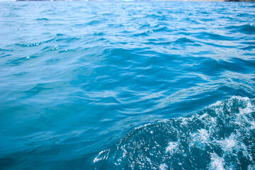 An abstract background of seawater flow under light exposure