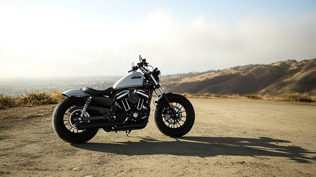 Motorcycle parked on empty road at sunset, hills in background