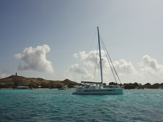 yacht in the sea - View of a sailboat with Los Roques National Park in the background