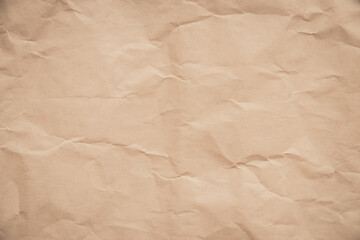 close-up of crumpled brown paper, revealing a texture reminiscent of aged parchment