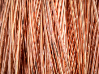 Aligned copper wires displaying consistent patterns and detailed textures in a parallel arrangement.