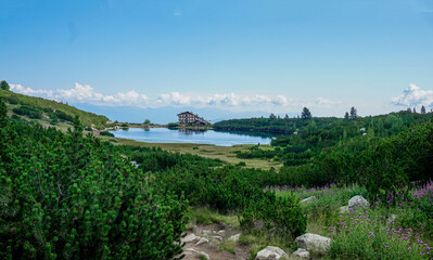 03_View of the famous Bezbog hut and its colourful lake in the Pirin Mountains, Bulgaria.