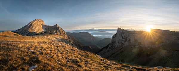 Panoramic view of mountains at sunrise. Vercors region in France. Colored sky