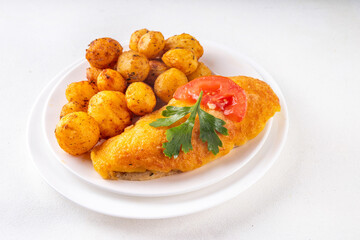 Breaded chicken cutlet with whole fried baby potato side