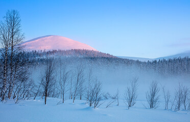 Sunset Light on a Snowy Ski Mountain