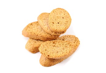 Heap of  toasted  sliced baguette breads, or croutons, on a white background.