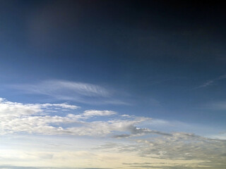 Big White Fluffy Clouds on A Blue Sky With Fine Whispy Lines