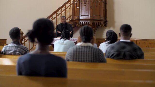 African american priest giving sermon to congregation in slow motion