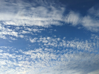 Big White Fluffy Clouds on A Blue Sky With Fine Whispy Lines
