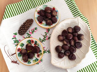 Shiny brown chestnuts on the table