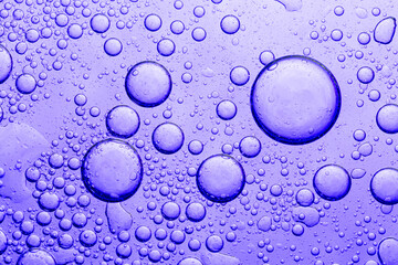 Purple Macro Drink Bubbles,water drops on a purple background,Bubbles detail and fancy drinks. Abstract background liquid and bubbles in violet toned.