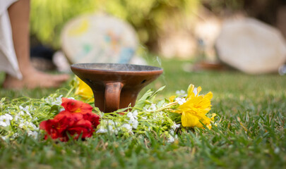 incense lit on the grass during a holistic cleansing session