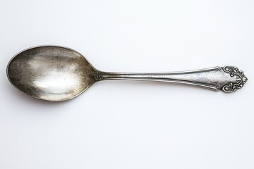Antique silver spoon on white background