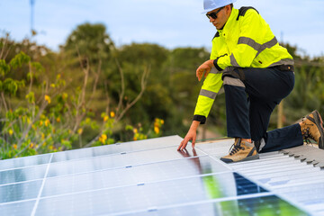 technician lifting a photovoltaic panel during installation, showcasing renewable energy advancement. Dressed in safety gear, reflecting a focus on green energy solutions and sustainable development.