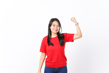 Showing strength and rise arms Of Beautiful Asian Woman wearing red shirt Isolated On White Background