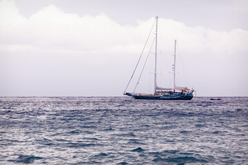 Fototapeta premium Serene Sailboat on Tranquil Sea 