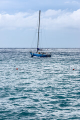 Naklejka premium Sailboat on Serene Ocean Waters