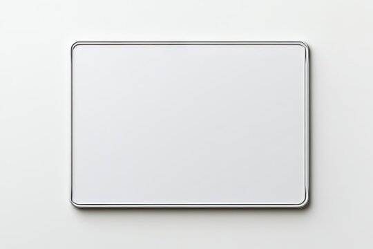 Minimalist whiteboard with metallic border on plain background