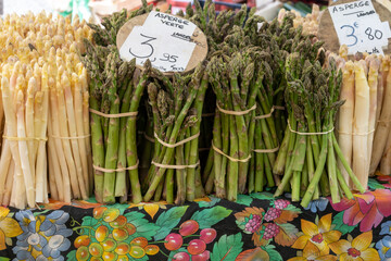 Fresh raw white and green asparagus vegetables for sale in local farmers market in Souillac,...