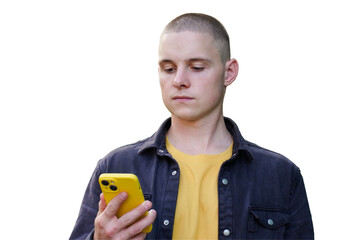Young man focused on smartphone  engaging with digital content in a casual outfit. the guy looks...