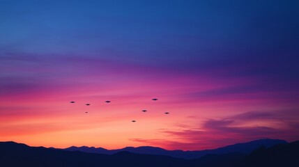 Obraz premium Awe-Inspiring Sunset Over Silhouetted Mountains: A Stunning Landscape Painting