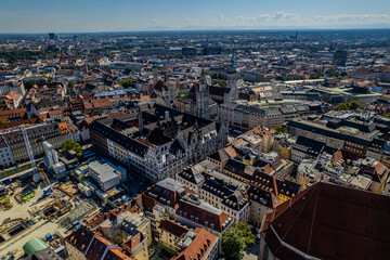 Beautiful aerial footage of Marienplatz the magestic New Town Hall, its clock and the Frauenkirche gothic church in the City of Munich Babaria Germany
