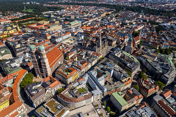Beautiful aerial footage of Marienplatz the magestic New Town Hall, its clock and the Frauenkirche...