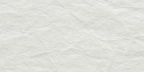 Fototapeta premium High-resolution image of crumpled, off-white paper texture showing subtle folds and creases