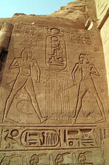 Wall relief of two male figures with the cartouche of Ramses II at the base of the image, Great Temple of Ramses II Abu Simbel Egypt

