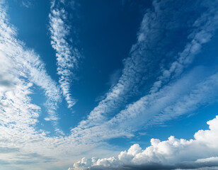 Cirrus and cumulus clouds against a blue sky