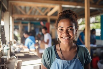 Obraz premium Portrait of a female volunteer working in sunny community center