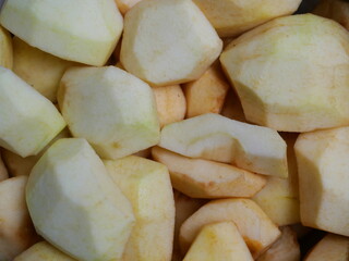 Apples, peeled and quartered - apple pieces, ready to be made into delicious fall dishes.