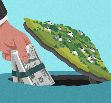 Hand stashing money in hole below island