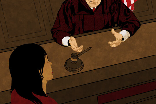 Judge talking to woman in court