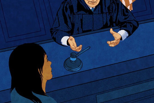 Judge talking to woman in court