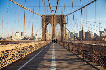 The Brooklyn Bridge during winter with a blue sky
