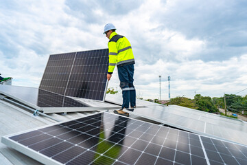 A skilled technician adjusts a solar panel on rooftop, emphasizing the transition to sustainable energy. Equipped with safety gear, the worker demonstrates precision in renewable energy installations.